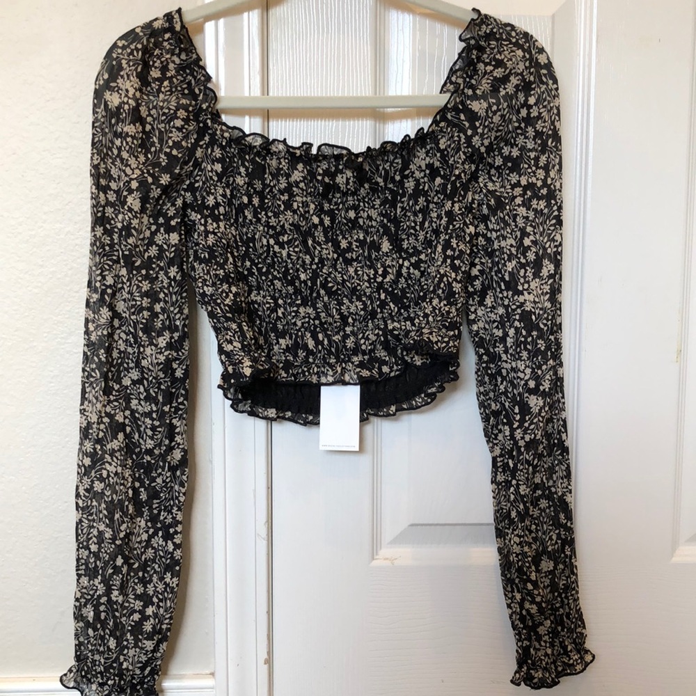 Beautiful and delicate ruched top with floral and silver details. #socialite